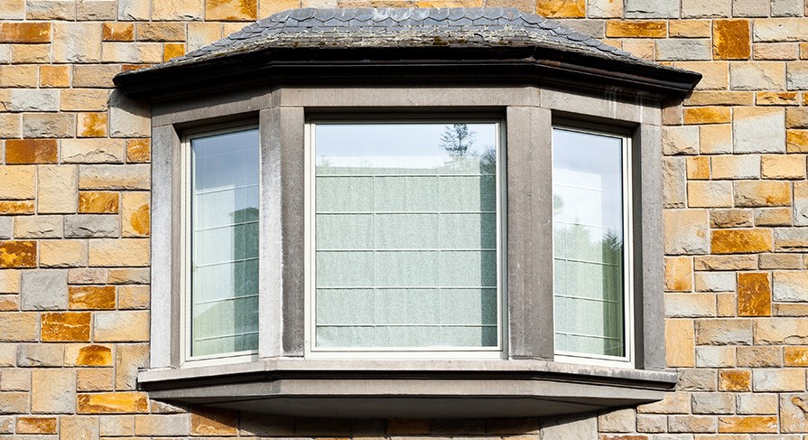 Bay & Bow Window shown on the side of a home
