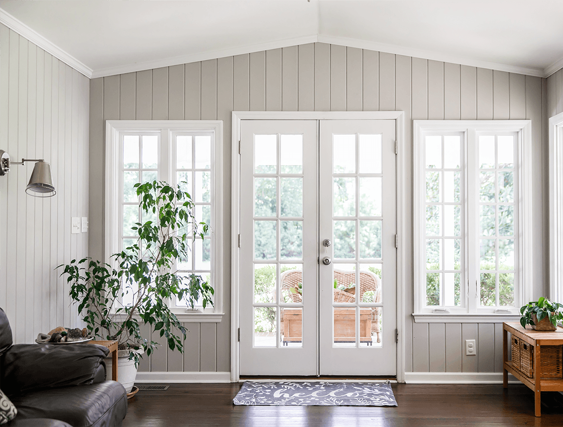 windows shown in the living room of a home
